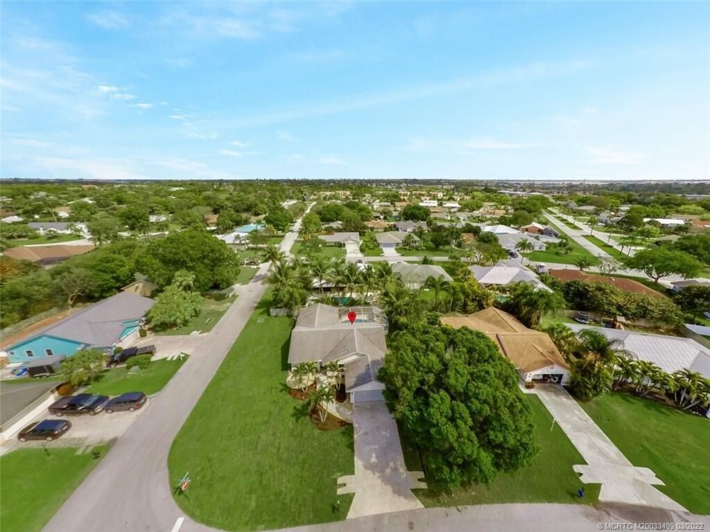 Photo of 1999 NE San Carlos Calle, Jensen Beach, FL 34957 (MLS # R10951415)