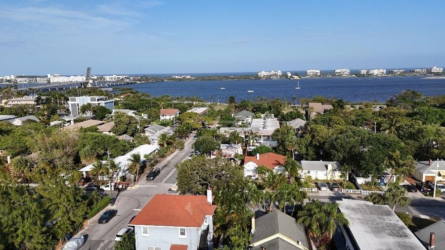 Historic Triplex on Ocean Breeze! Just steps to all the amenities: Bryant Park and the Intracoastal Waterway (at it's widest) 2 blocks. Park your boat (or RV) in the backyard, and use the Public Boat Ramp to launch onto navigable water! Public golf course, historic amphitheater, bridge to the beach; all within FEET (as the crow flies). 304 (300 sq ft studio)and 308 (1 bed 1 bath) rented for $1500 and $1600 a month annual leases. 2 front units have their own Washer Dryers & new panels. No cast iron drain pipes. LWB has reverse osmosis water flowing from the taps; yes you can drink from the taps!  306 is 2 bed, 2 bath, 917 sq ft unit with soaring ceilings; needs  rehab.3 separate house #s; could be converted to condos.  Leave the stress, decompress LOVE WHERE YOU LIVE!
