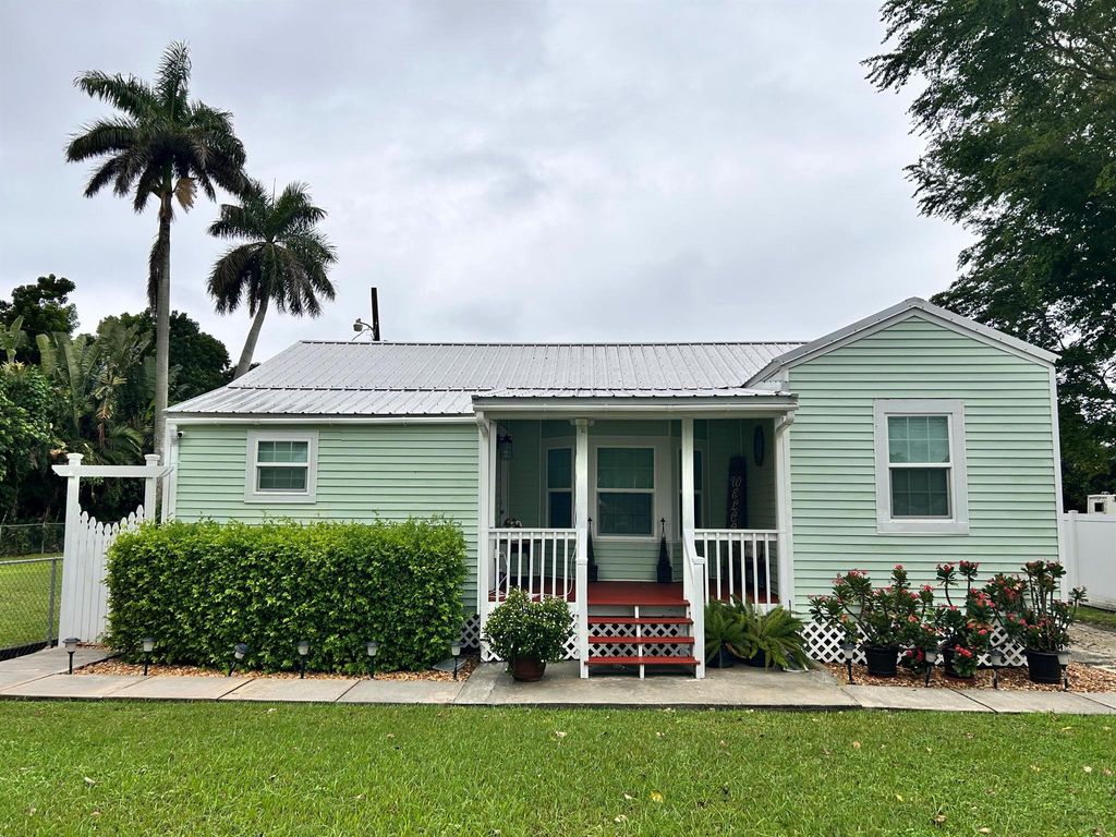 Photo of 1931 Bacom Point Road, Pahokee, FL 33476 (MLS # R11028571)