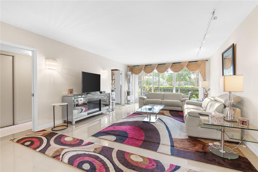 Photo of 3800 Oaks Clubhouse Drive #110, Pompano Beach, FL 33069 (MLS # F10528282)