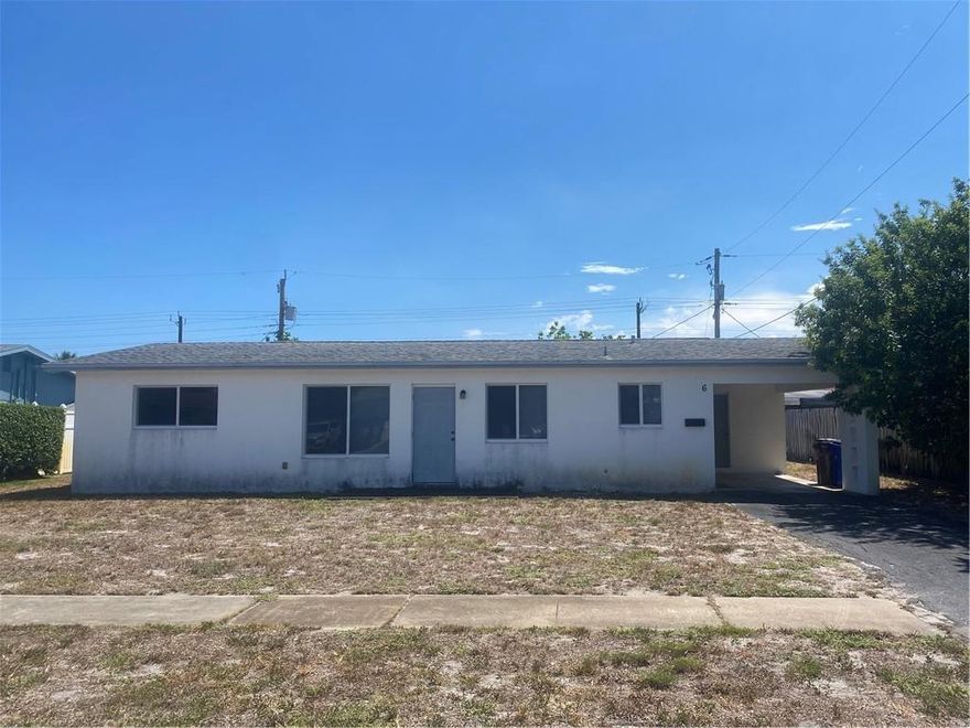 Great opportunity to own a 3 bedroom, 2 bathroom home in a lovely East Deerfield Beach neighborhood. This home has all impact windows and sliders and an upgraded GE electric panel! The roof and AC were replaced in 2010. The updated, clean and functional kitchen is equipped with modern appliances. Cosmetic updates will transform this property into a beautiful 3/2 home. The huge backyard has room for a pool and more - create your backyard oasis or simply relax on the shady, outdoor covered patio off the living room. Laundry room is accessed from the carport. Don't miss this opportunity!