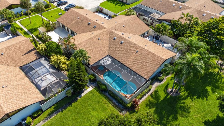 This is your chance to own the lowest-priced pool home in Boca Raton with a new roof! The owner has already invested over $70,000 in upgrades and now, a sudden move means you can enjoy it all. Step inside this beautifully updated, move-in ready townhome in the all-age community of Boca Gardens. The open, split-bedroom layout offers privacy and comfort, with a cozy primary suite featuring dual vanities and an upgraded large bath, custom closet shelving and patio access from all bedrooms. Soaring ceilings and skylight fill the home with natural light. Outside, unwind in your spacious, fenced-in screened patio with a private pool. With a new roof (2022), A/C (2024), water heater (2024), accordion shutters (2019) and total plumbing re-pipe (2024), you'll enjoy years of worry-free living