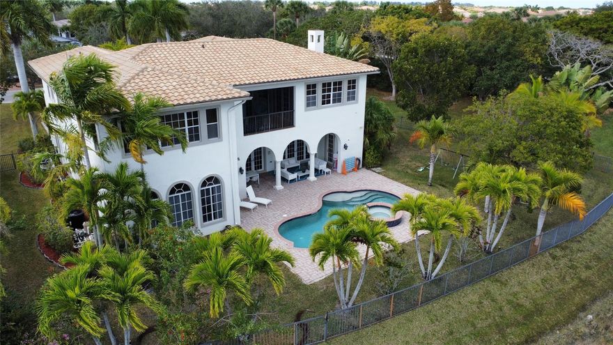 HUGE CORNER LOT! This exceptional residence in guard-gated Heron Bay community has it all and is priced to sell. Beautiful open-concept kitchen surrounded by windows that flood the space with natural light, creating a bright and inviting atmosphere perfect for everyday living and entertaining. This stunning 6-bedroom, 6-bathroom estate also includes a private office and an oversized recreation room, offering both luxury and functionality throughout. The primary suite serves as a private retreat, complete with a sitting area, spa-inspired bath. Enjoy resort-style amenities including clubhouses, fitness centers, pools, tennis courts, and more, all within a family-friendly neighborhood served by top-rated schools. This home offers the perfect blend of space, comfort, and luxury living.