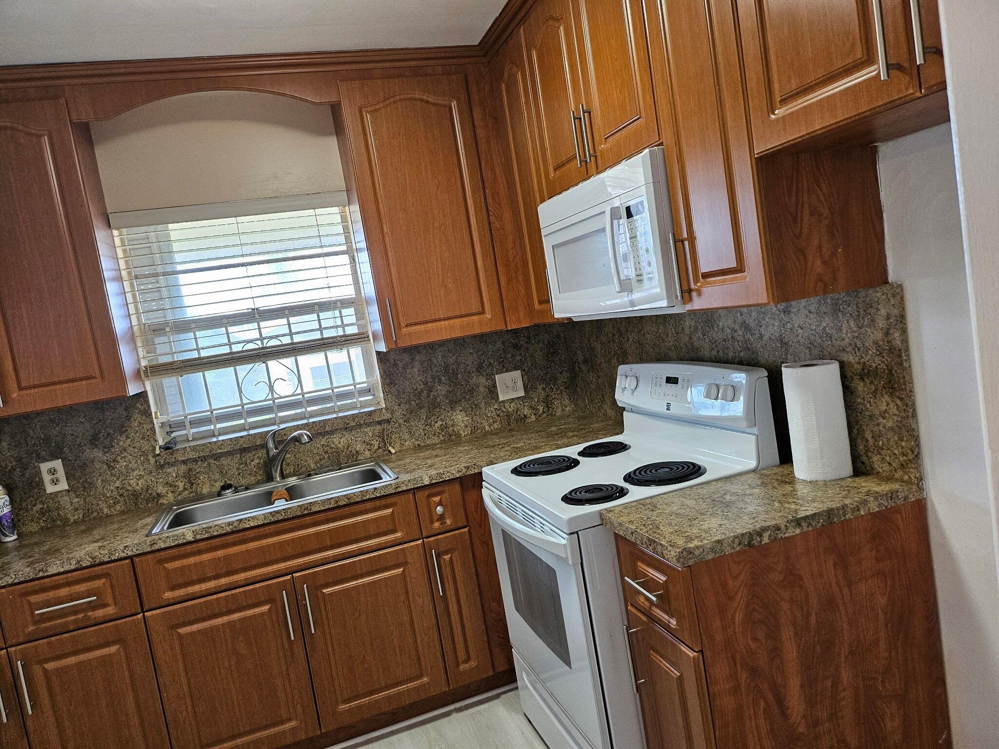 Great condo with new paint overlooking pool and shuffleboard.