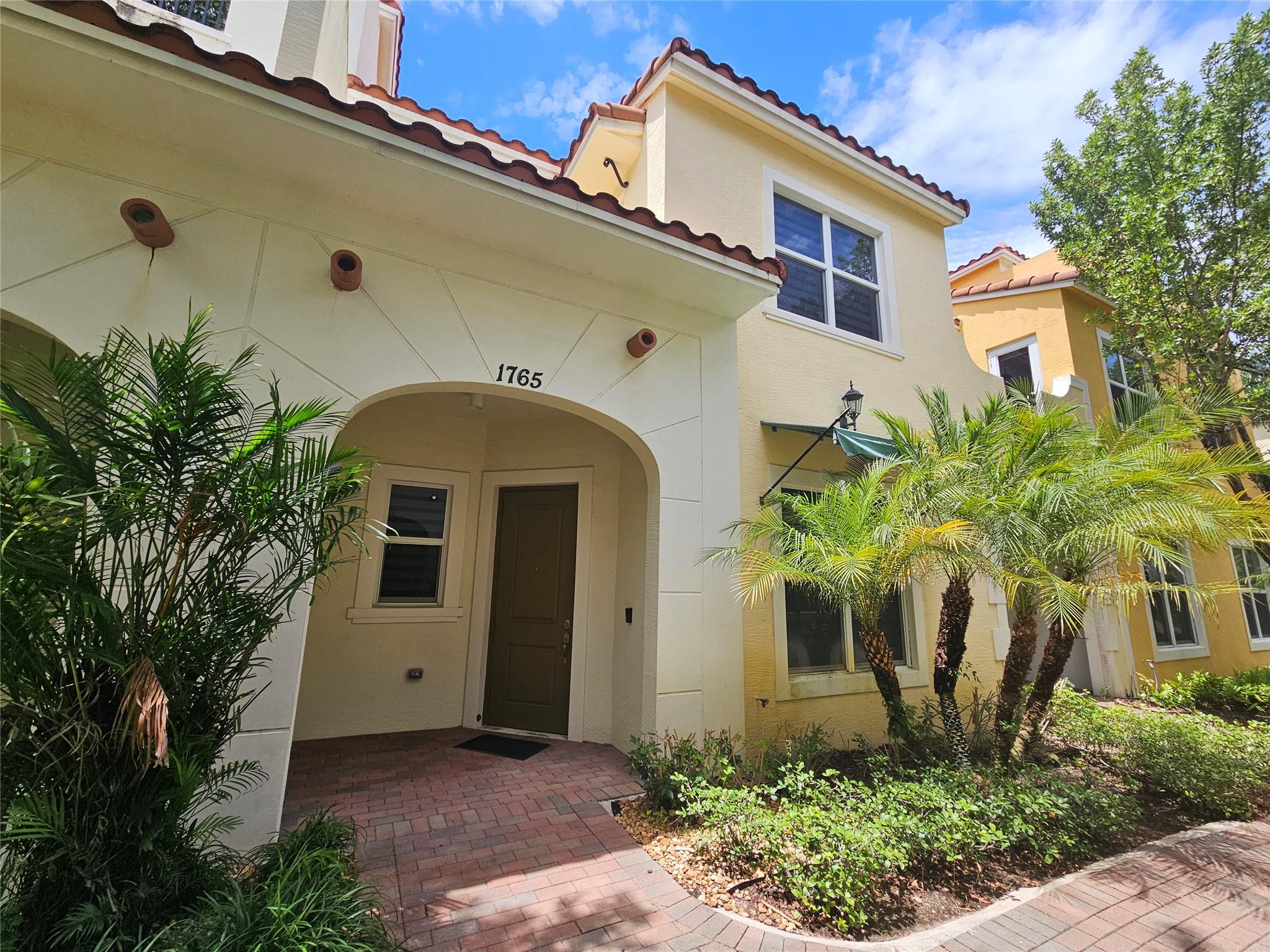 This beautifully maintained 3 bedroom, 2.5 bathroom townhouse with a 2-car garage is located in an upscale Mediterranean-style community offering a blend of elegance and comfort. The home features quartz countertops, stainless steel appliances, and a washer and dryer upstairs in an enclosed laundry room for your convenience. Hurricane impact doors and windows for added security. Spacious living areas provide natural light and modern finishes throughout. Half guest bathroom is downstairs. The community includes a resort-style pool and a fully equipped exercise room. Centrally located near shopping, dining, and excellent schools, yet tucked away in a quiet and private setting, this residence is ideal for a family or couple. Priced for a quick sale and easy to show.
