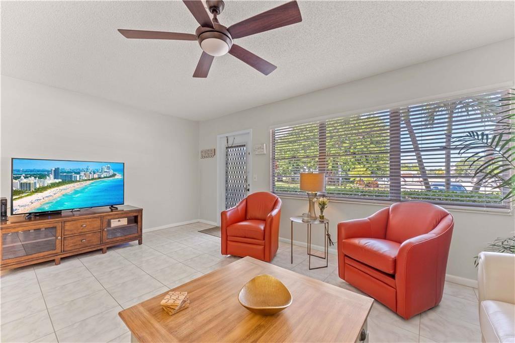 WIFI INTERNET, BASIC CABLE, WATER & ELICTRIC INCLUDED in seasonal rent amount. Welcome to the wonderful 55+ community of Century Village Deerfield Beach. Desirably decorated & furnished 1/1.5 ground floor unit. Laminate wood flooring throughout bedroom and tile throughout living room and bathrooms with updated kitchen and appliances. Enjoy breakfast on the lakefront patio before taking a leisurely stroll through the community on your way to the pool or tennis courts. Cable TV and Internet included. Unit located next to laundry room and elevator. Gym, Tennis Courts, Community Pool, Clubhouse. Pet restrictions per HOA. Minutes from Hillsboro Beach, Boca Town Center & other shops & dining. Easy access to I-95, Sawgrass Expressway & turnpike.