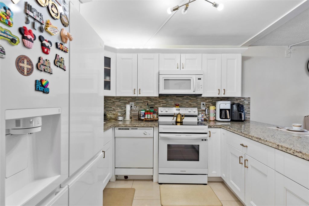 Photo of 9300 SW 8th Street #102, Boca Raton, FL 33428 (MLS # B26038507)