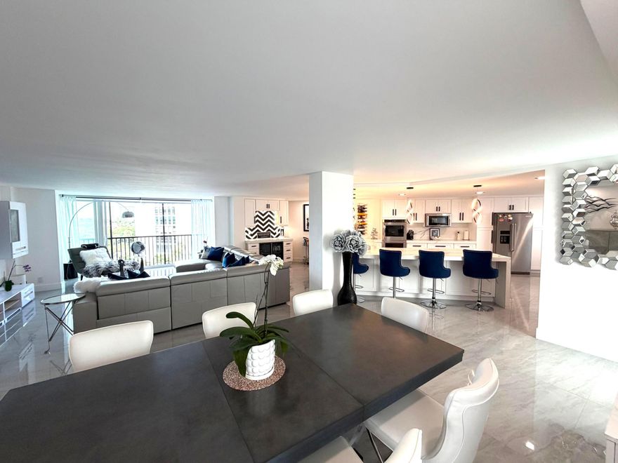 Superbly spacious and totally renovated condo in a fully renovated building. Building renovation includes roof, concrete / structural repairs / parking lot improvements and painting. Condo has ACs 2023, impact windows 2024, ceramic flooring, floor to ceiling tiling in bathrooms, totally updated kitchen with 24ft peninsular island (yes, 24ft). Walk to shps, restaurants, bars and the beach. Master bedroon has two closets, and a great view. All work permitted and permits closed. Currently condo has access to a 30ft dock with power and water. Building has pool, community gym and community room. Professional photographs to follow