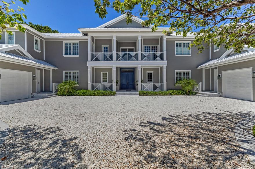 On over a half-acre, this stately custom-built estate in exclusive Point Manalapan offers a spacious floor plan, with spacious rooms that open to the loggia, covered lanais and balcony viewing the expansive backyard entertaining area centered on a large, refinished heated pool. Highlights include the living room's soaring vaulted ceiling, and the mirrored bar/buffet in the formal dining room.