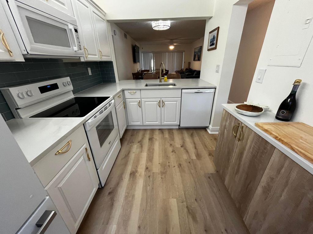 Photo of 12830 Briarlake Drive, West Palm Beach, FL 33418 (MLS # B26026247)