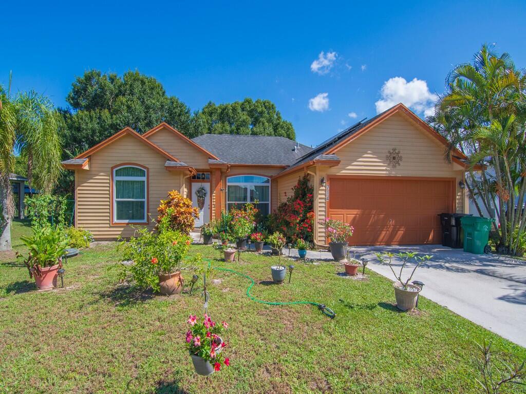 Welcome to 712 SW Andrew Rd--a charming single-family home nestled in the heart of Port St. Lucie. Located in a peaceful residential neighborhood, this property offers the perfect blend of comfort, convenience, and Florida lifestyle. Spacious layout ideal for families and a large backyard with room for outdoor entertaining. This home has newly remodeled bathrooms, new hurricane impact windows and solar panels. Convenient to turnpike and I-95. Whether you're a first-time buyer, downsizing, or investing, 712 SW Andrew Rd is a fantastic opportunity to own a piece of paradise in one of Florida's fastest-growing cities.