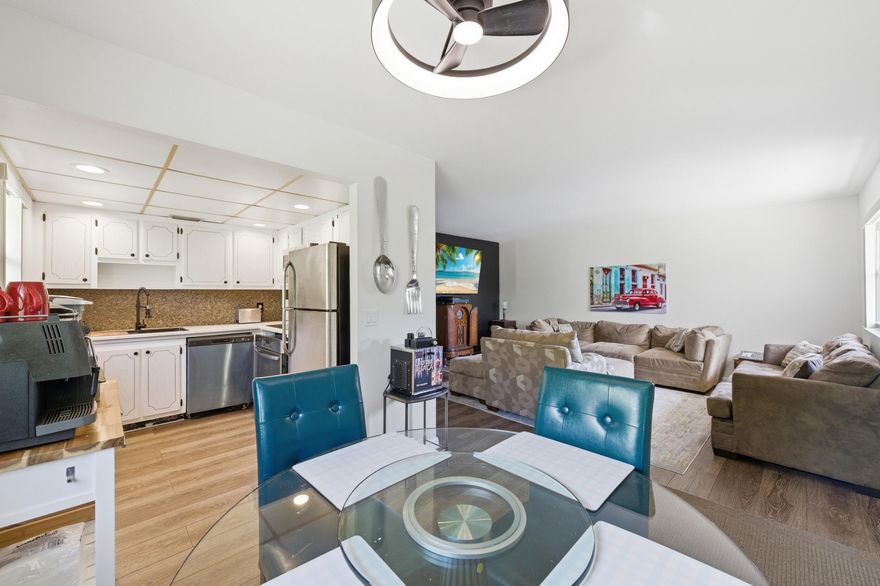 Don't miss this bright 2nd-floor true corner condo at the end of the building in the highly desirable Kings Point Golf and Country Club 55+ community! Enjoy abundant natural light, a serene garden-view patio, and a move-in ready, fully furnished interior featuring stunning wood-like laminate flooring, smooth ceilings, updated bathrooms with glass shower doors, new vanities, and light-up mirrors, plus stunning accent walls, updated light fixtures, and ceiling fans. The kitchen boasts stainless steel appliances, and major updates include a recently replaced roof, newer A/C, and water heater 4-5 years old. Assigned parking is conveniently located right in front of the building. Kings Point offers resort-style amenities including indoor and outdoor pools, clubhouse, theater, fitness center,  tennis and pickleball courts, golf with no membership fee, café, workshop, beauty salon, library, billiards, social clubs, and a courtesy bus. Enjoy the perfect South Florida lifestyle with shopping, banks, hospitals, highways, and the vibrant Atlantic Avenue—restaurants, nightlife, and entertainment—just minutes away. This home truly has it all!