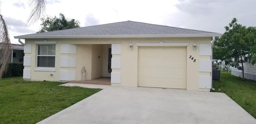 2 BR 2 BA 1 CG CBS home in the 55+ Active community of Spanish Lakes Riverfront in Eastern PSL. This home features spacious floorplan with split bedrooms, large covered patio, and full appliance pkg. NEW AC recently installed !! NEW carpet. NEW microwave, and washer and dryer are included. Land lease includes access to all of the community amenities, as well as access to the owners pool and clubhouse in Spanish Lakes 1.