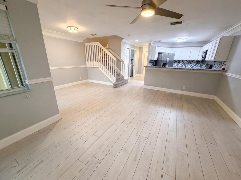 Photo of 917 Imperial Lake Road, West Palm Beach, FL 33413 (MLS # B26020513)