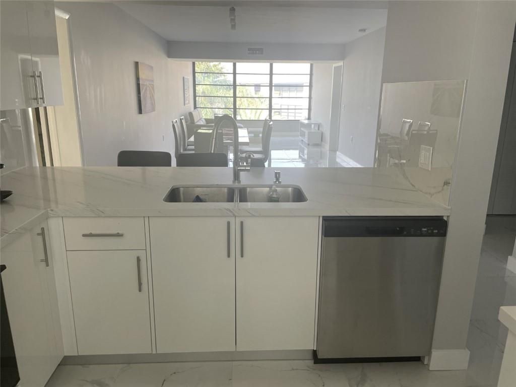 Photo of 1721 Whitehall Dr #404, Davie, FL 33324 (MLS # F10540834)