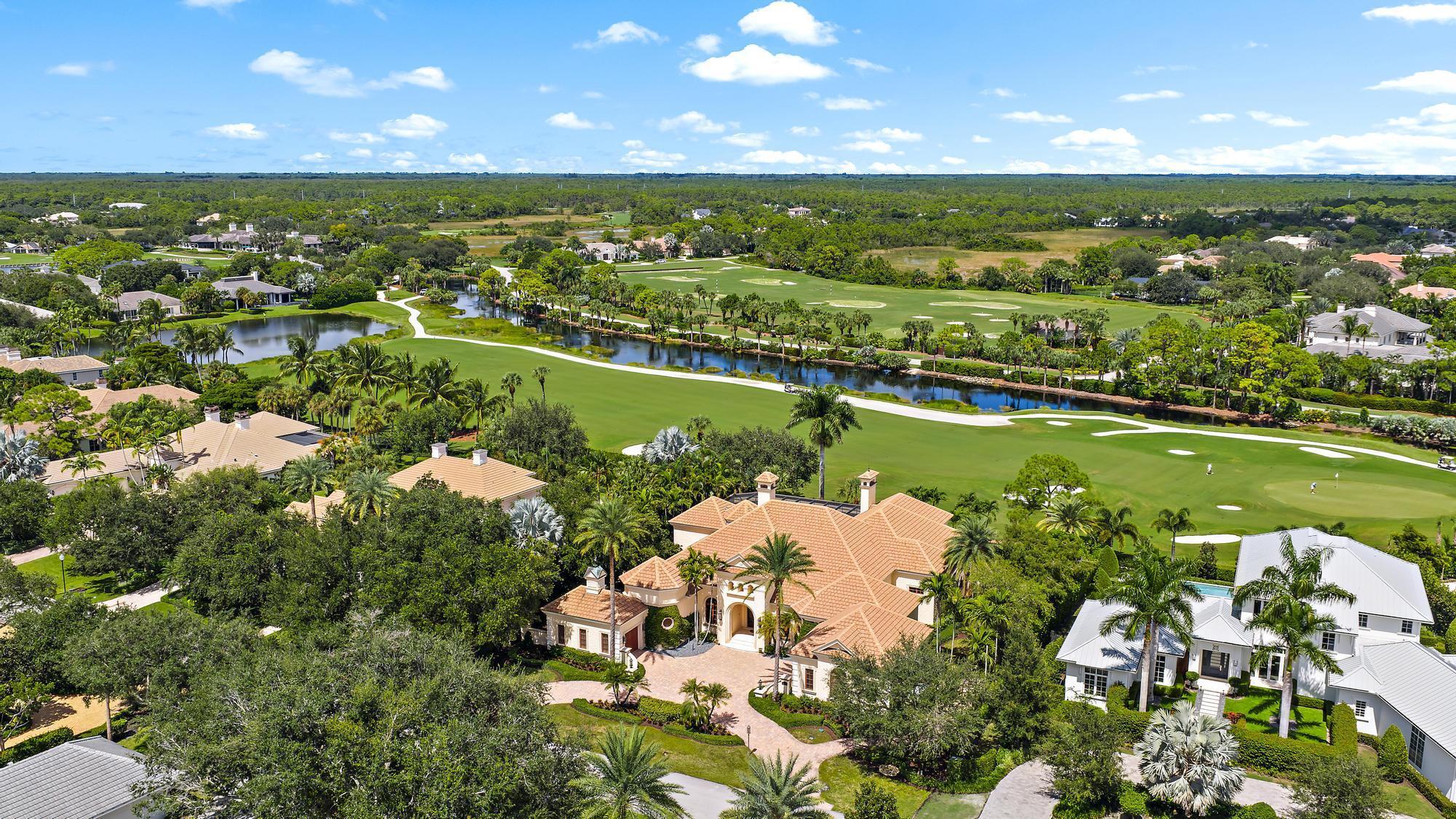 Exquisite custom estate with breathtaking views of the first hole of the Pete Dye Championship golf course.  Old Marsh Golf Club is one of the finest gated club communities in all of Palm Beach County with a limited membership to only 275 members, a no tee time policy and a renowned caddie program. Old Marsh is a gated enclave of 180 custom estates and easy access to Palm Beach International Airport and is located only minutes to 5-Star dining, beautiful beaches and renowned Palm Beach shopping. The residence boasts the finest quality throughout with custom craftsmanship, imported finishes and no detail overlooked.  Designed by Village Architects and built by First Florida Construction, this estate features dual baths in the primary bedroom, custom theater room, a spacious office and two