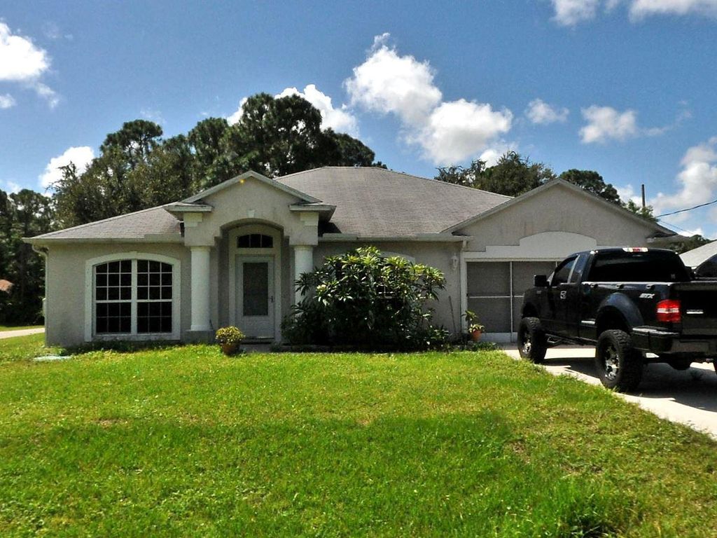 Photo of 1750 SW Capehart Avenue, Port Saint Lucie, FL 34953 (MLS # R10794220)