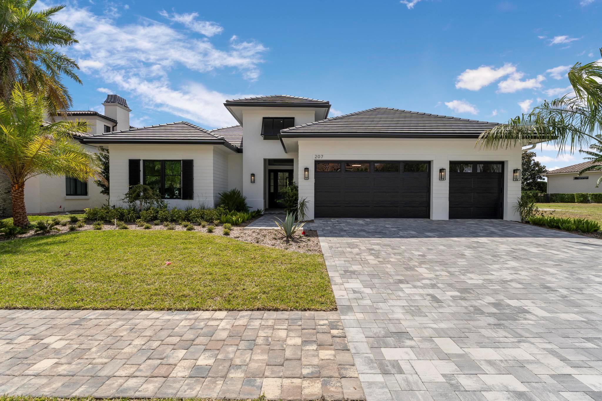 Experience the pinnacle of luxurious living with the newly constructed Augusta Custom Pool Home by Ecclestone Signature Homes. This exquisite coastal modern residence offers breathtaking water views and is located within the highly sought-after Tesoro Club, a prestigious gated golf community. This expansive one-story home features four bedrooms and 4.5 baths, complemented by a wet bar and a walk-in pantry.The open floor plan is perfectly designed for both relaxation and entertaining. The gourmet kitchen is a chef's dream, featuring high-end Thermador appliances, a generous center island with back-to-back cabinetry, elegant quartz countertops, a full backsplash, and stunning cabinetry. Numerous upgrades are included, with project completion anticipated in early spring 2025.