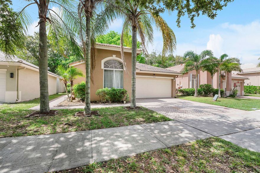 Beautifully updated and competitively priced, this inviting home in the gated community of Regency Lakes offers the perfect blend of comfort, style, and family-friendly living. Vaulted ceilings, crown molding, and an open-concept create a bright and welcoming feel throughout the home. The updated kitchen features granite countertops, white shaker cabinetry, stainless steel appliances, and expanded counter space ideal for cooking and entertaining. This open floor plan provides plenty of living space, an eat-in kitchen and stylish laminate flooring flows throughout. The primary suite offers an updated bath with modern cabinetry and a seamless glass shower. A flexible third bedroom with double-door entry is perfect for a home office/den, or guest room.  Enjoy relaxing outdoors on the private patio with mature landscaping with shade. Residents enjoy resort-style amenities including a central clubhouse, a fitness center, a swimming pool, a hot tub, a tot lot, and sports courts for basketball, sand volleyball, and tennis/pickleball, along with four satellite pools. Landscaping and high-speed internet included in the HOA. Conveniently located near shopping, dining, and major commuter routes. Move-in ready- this one won't last!