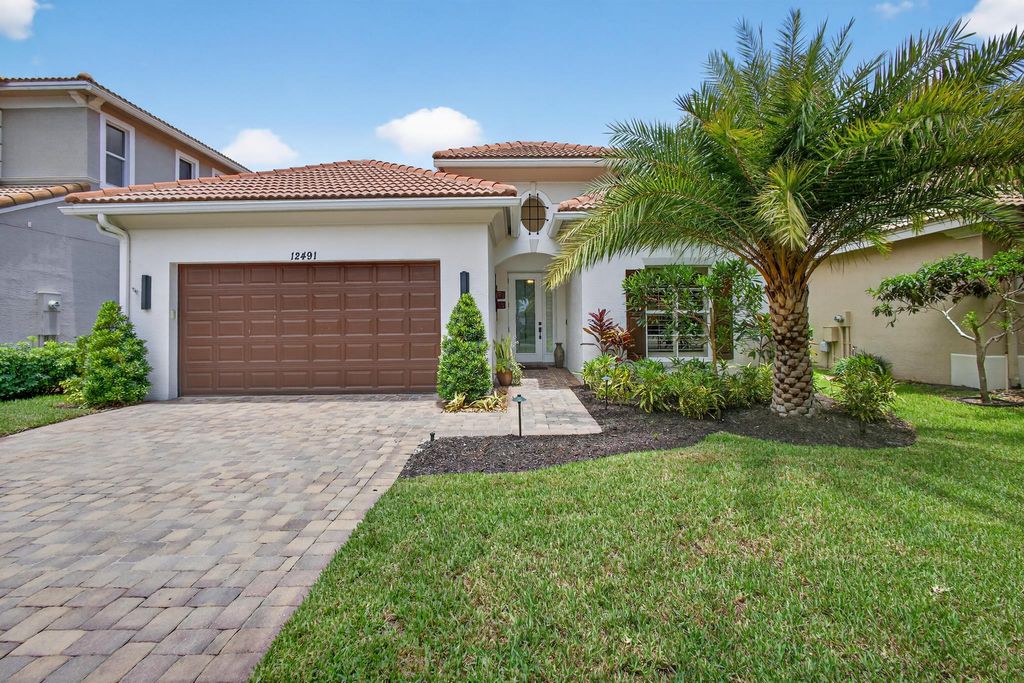 Photo of 12491 Aviles Circle, Palm Beach Gardens, FL 33418 (MLS # R11103062)