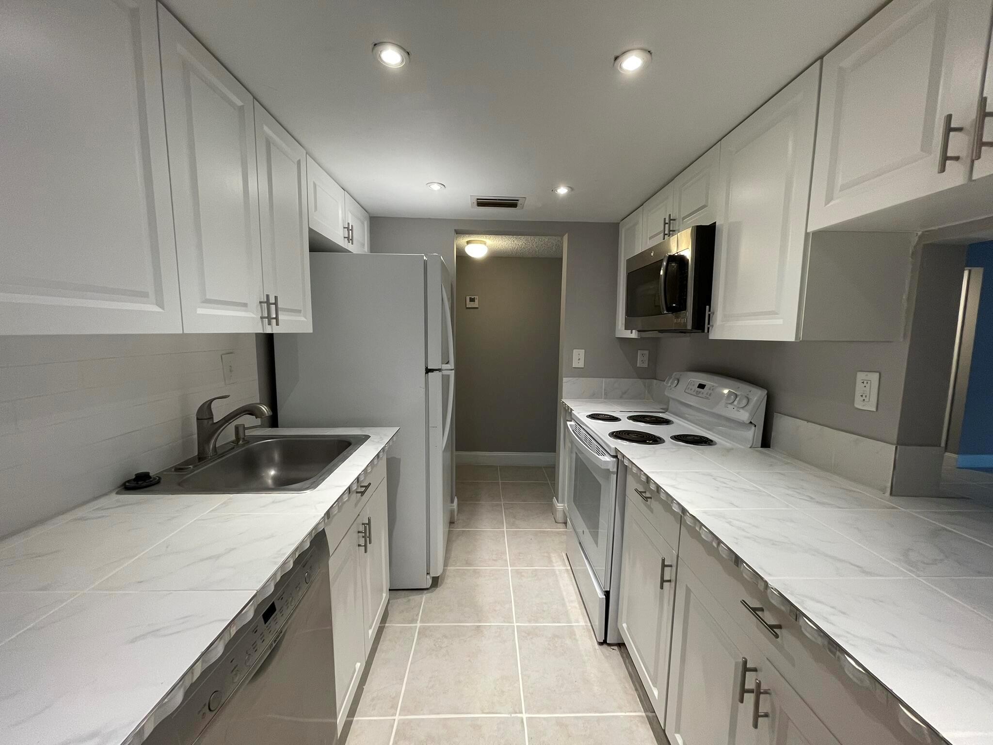 INCREDIBLE INVESTMENT OPPORTUNITY! You can lease immediately after purchase. No credit score min nor income requirements, no hoa approval. Tenant occupied until 1/7/25 paying $2000 a month. 12% ROI. CASH FLOW from Day 1. This modern 2/2 condo is fully renovated from the kitchen to the bathrooms. Ceramic tile flooring throughout. Tons of natural light. Very spacious bedrooms and living room. The primary bedroom has a large walk-in closet. Plenty of outdoor space with a large covered balcony. The building has Elevators! Featuring a pool and 24 hr security patrol. Prime location! Walking distance to the Palm Beach Outlets, shopping, restaurants & bars. A quick drive to the beaches, Downtown WPB, Clematis, Kravis Center, Rapids, Grandview Market, Gardens Mall, I-95, PBI Airport and hospitals!