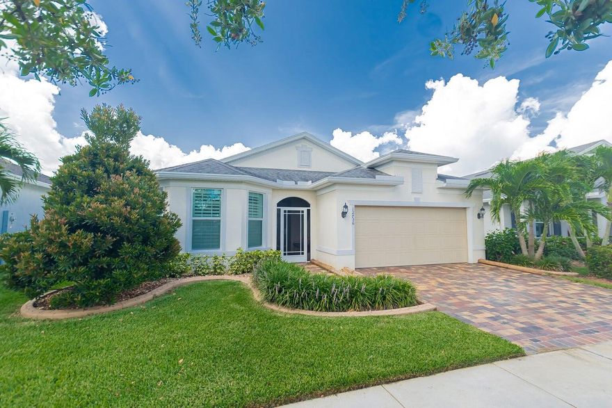 Luxurious 2/2/2 + flex room lakefront home with over 150k in upgrades. This open floor plan home features tile floors throughout. Crown molding, plantation shutters & 8' doors. Gourmet kitchen featuring quartz counters, tiled back splash, walk in pantry, 42'' cabinets & gas cooking. You truly have indoor outdoor living here with the beautiful lake view from your extended covered & screened in lanai with ceiling fans. There is an additional open area paved patio that has a retractable shade to enjoy this space. The home has a doggie dog leading to a fenced in yard for your fur babies to enjoy. Impact windows, tankless water heater & whole house generator. Amenities incl. 2 pools, 2 clubhouses, gym, pickleball, tennis, bocce & more!