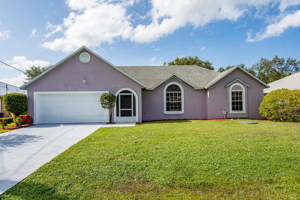 Photo of 2817 SE Rawlings Road Rd, Port St Lucie, FL 34952 (MLS # R10755310)