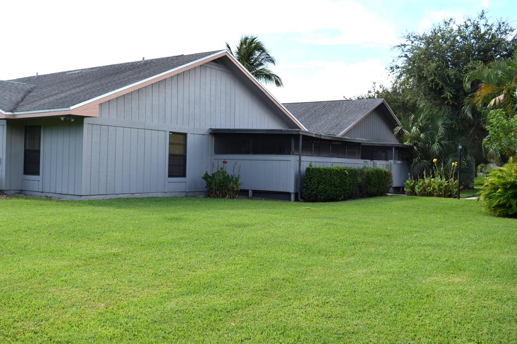 Amazing 2 bedroom, 2 bathroom home with screened patio and hurricane shutters, backing up to large grassy area and privacy trees. Tile flooring throughout, ceiling fans in all rooms and patio, full size w/d, flat top glass stove, microwave, dishwasher and refrigerator included. New hot water heater and A/C only 8 years old. Located right off Goldenrod and US-1 allows easy access to Beaches, shopping and downtown Stuart.