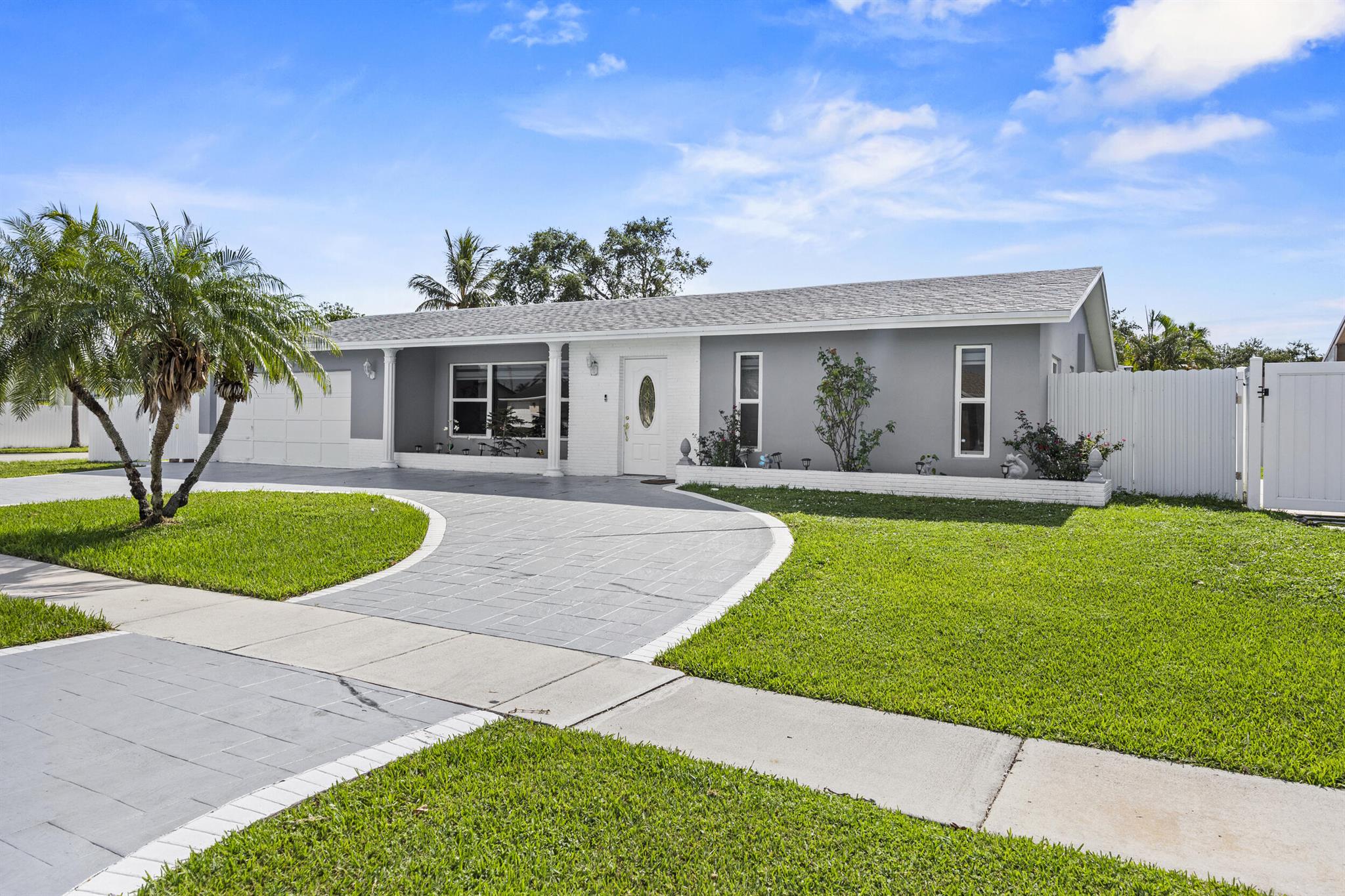 This stunning corner lot home offers an exceptional blend of comfort and convenience. It features 4 bedrooms, 3 bathrooms, and a versatile, fully permitted bonus garage conversion that includes an additional bathroom. This flexible space is perfect for a home office, an in-law suite, or extra living area. The home boasts an updated kitchen with beautiful quartz countertops and a newly renovated master bathroom. For your peace of mind, the property also includes a new roof and impact windows throughout. You'll love the expansive, fenced-in backyard, complete with a paved patio and a refreshing in-ground pool, ideal for entertaining and relaxation. With no HOA, access to great nearby schools, and convenient proximity to major highways, this home offers the perfect blend of comfort and