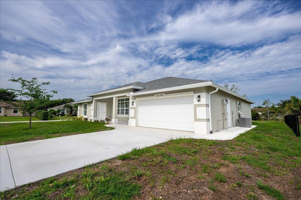 Photo of 2298 SE McMaster Street, Port Saint Lucie, FL 34952 (MLS # R11012308)