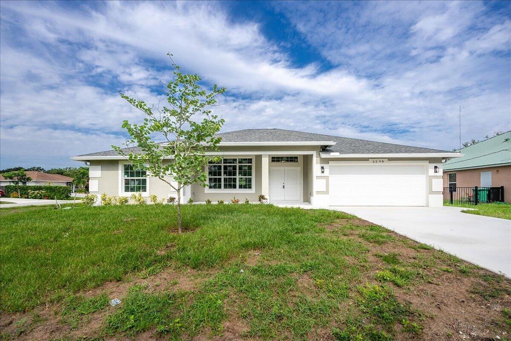 Photo of 2298 SE McMaster Street, Port Saint Lucie, FL 34952 (MLS # R11012308)