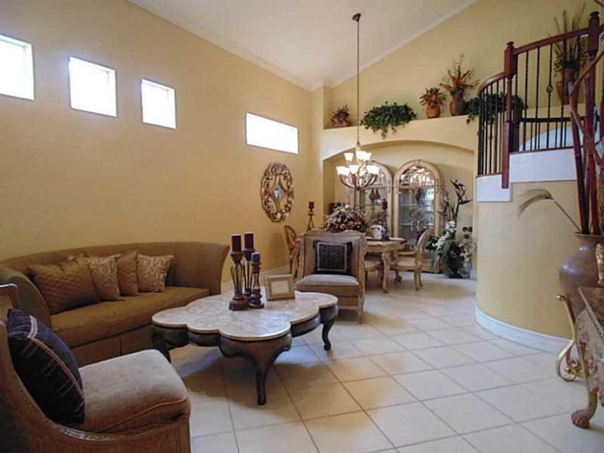 Heron Cove In Heron Bay. 4 Bed, 3 Bath, 2 Car Garage, 2 Story Home On Lake. Upgraded Kitchen With 42" Dark Wood Cabinets, SS App, Granite Counters, Snack Bar, Pantry & Eat-In Area. All Tiled Down.  All Wood Up. No Carpet. Upstairs Master Suite with a Sitt ing Area & Balcony Overlooks Lake, Shower & Jacuzzi Tub. One Bedroom & Full Bath Downstairs. Indoor Laundry. Community Has 2 Clubhouses,Pools,Tennis,Sauna& More! Rent Incl. Lawn Service. 1st/Last/SecDep Due. Tenant Pays Screening & Must Carry Renters Ins.