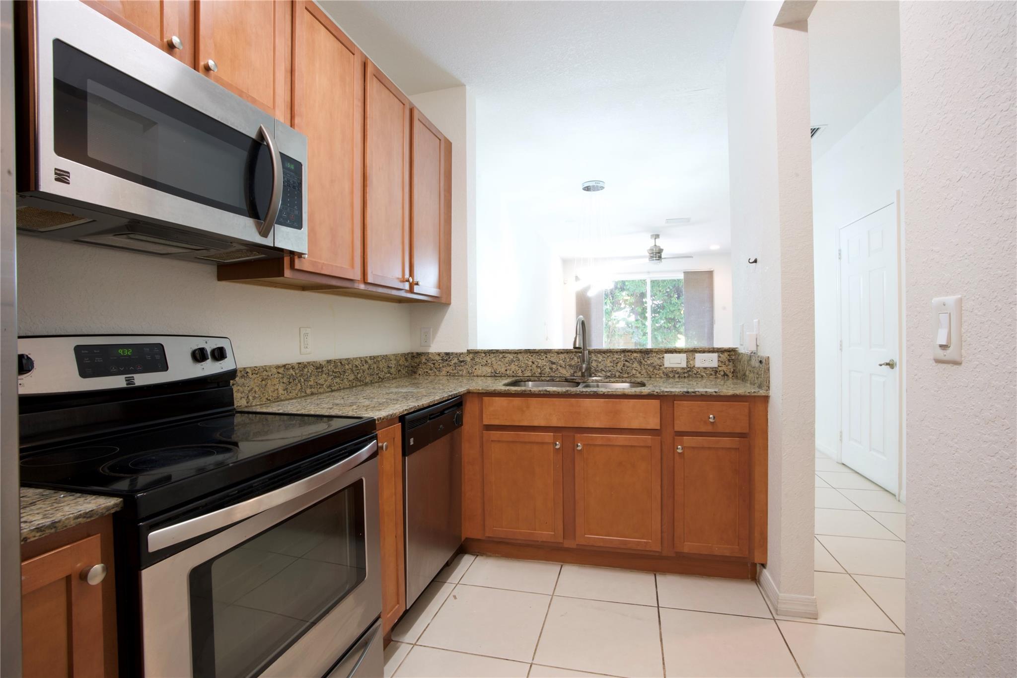 This spotless Mediterranean style townhome is located at the Village Walk of Miramar. This property features an open-floor plan with modern kitchen with granite counter top, SS appliances, 2 pantries with ample storage, solid wood cabinets, under-stair storage, built-in tv unit, and hurricane panels in the living room closet. Stackable washer and dryer, 2 bedrooms with walk-in closets, 2 bathrooms are located on the second floor. This bright unit has tile on the main floor and laminate wood on the second floor.
The Community offers secured gated entrance, community pool with recreation area and playground. It is located close to Walmart, Sam's Club, Pembroke Lakes Mall, The Shops at Pembroke Gardens, many restaurants.