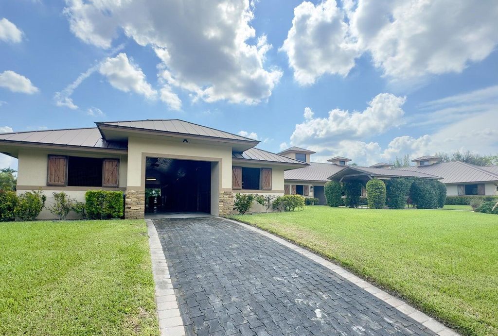 Photo of 11951 Hawk Hollow, Lake Worth, FL 33449 (MLS # R11135819)