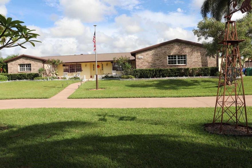 Must see this exceptional tropical property!!! 6 Bed 3 Bath on 2.5 acres Main house 2,731 sq. ft. 4 Bed 2 Bath Adjoining guesthouse 2-Bed 1-Bath with its own kitchenette, private entrance and HVAC providing ample space for guests. Freestanding metal building 50'X32' W/14' eaves W/2 attached stalls, great for hobbies, toys or workshop Perfect for home-based businesses Ample parking for vehicles or trailers. Fully fenced Shared spring fed lake along with 300' of canal frontage Deep water well Tropical landscaping w/ Mangos Avocados Bananas Papayas & Coconuts palms.  27'round above ground pool with solar heating Attached 16'X20' elevated gazebo Easy access to highways, airports, professional sport venues, shopping, hospitals, restaurants, schools Click on Matterport link for unfurnished view