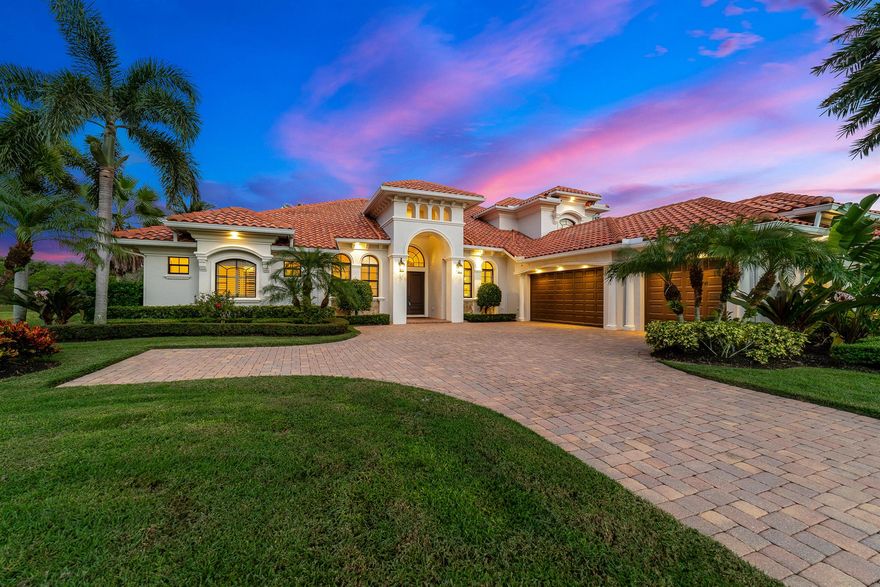 Welcome home to this exquisite 5-bedroom, 5-bath luxury estate located in the prestigious gated waterfront community of Ravello. Designed with timeless elegance and exceptional craftsmanship, this home offers both grandeur and comfort across every detail. From the large 24'' x 24'' porcelain tile throughout the main living areas, to the vaulted tray and coffered ceilings - every detail of this home is built to impress. The expansive main-level owner's suite provides an oversized private bath with dual spacious California custom walk-in closets. All four of the additional bedrooms feature private access to an en-suite bath for ultimate convenience.