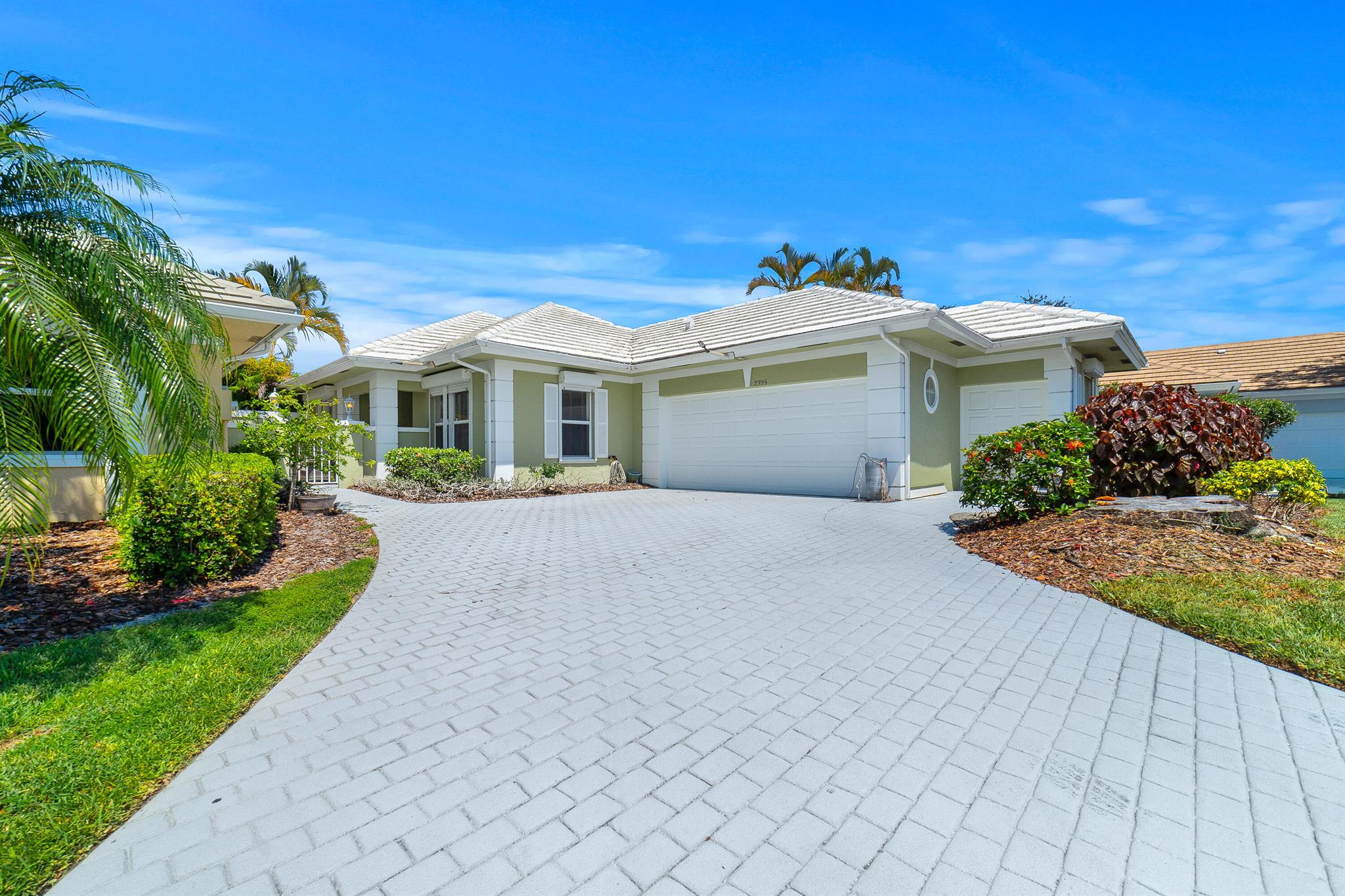 Welcome to this beautifully updated home in the sought-after Monarch Country Club. Positioned along the 15th fairway of the renowned Arnold Palmer Course, this residence offers stunning wide-open views right from the living room, creating a serene and picturesque backdrop.This home features 3 spacious bedrooms and 3 bathrooms, each showcasing custom tile work and new vanities. The completely redesigned kitchen boasts a lifetime guarantee on its cabinets, complemented by new white quartz countertops and a stylish tile backsplash. A wet bar in the living room adds to the home's appeal, featuring granite countertops, tiled walls, and a new stainless steel sink and faucet.Recent upgrades include a 2024 A/C and air handler with a 10-year warranty, along with windows offering