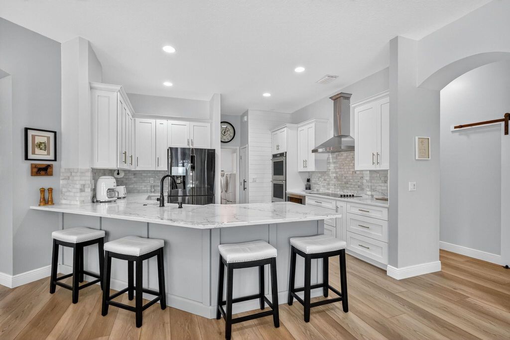 Photo of 5059 SW Hammock Creek Drive, Palm City, FL 34990 (MLS # R11112507)