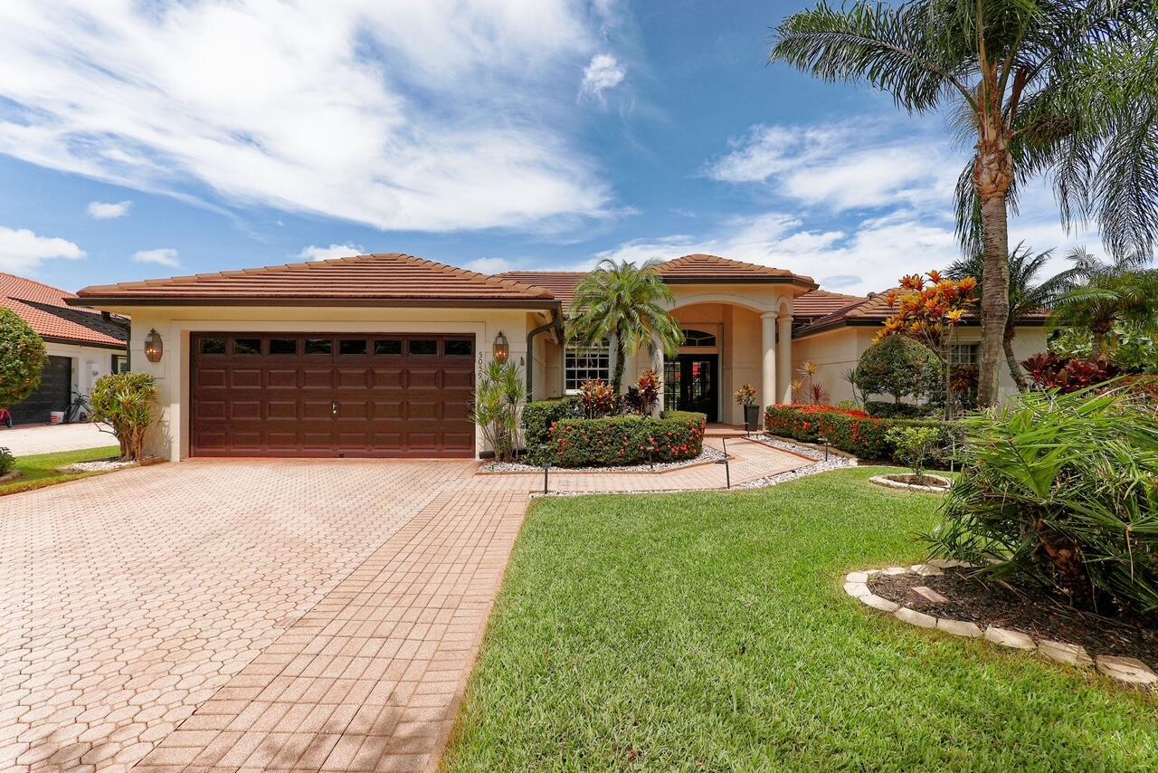 This is the ONE! Elegant and spacious, this 4 bedroom, 3 full bathroom, one story pool home sits on an oversized 1/3 + acre lot with a sparkling salt water pool and spa, large screened in patio that backs to the 18th fairway of Hammock Creek Golf course. It features a newer roof (2020), accordion shutters, exquisitely renovated open kitchen (2024) complete with double oven. The family room showcases a custom wall with mounted electric fireplace and TV. Luxury vinyl plank flooring throughout the main areas and bedrooms, plenty of natural light, with high end finishes. Split floorplan affords privacy, large primary bedroom and bathroom and a cabana bath. No Carpet! The Sanctuary has a private gate. Hammock Creek has no mandatory membership! Jack Nicklaus legacy design 18 hole course.