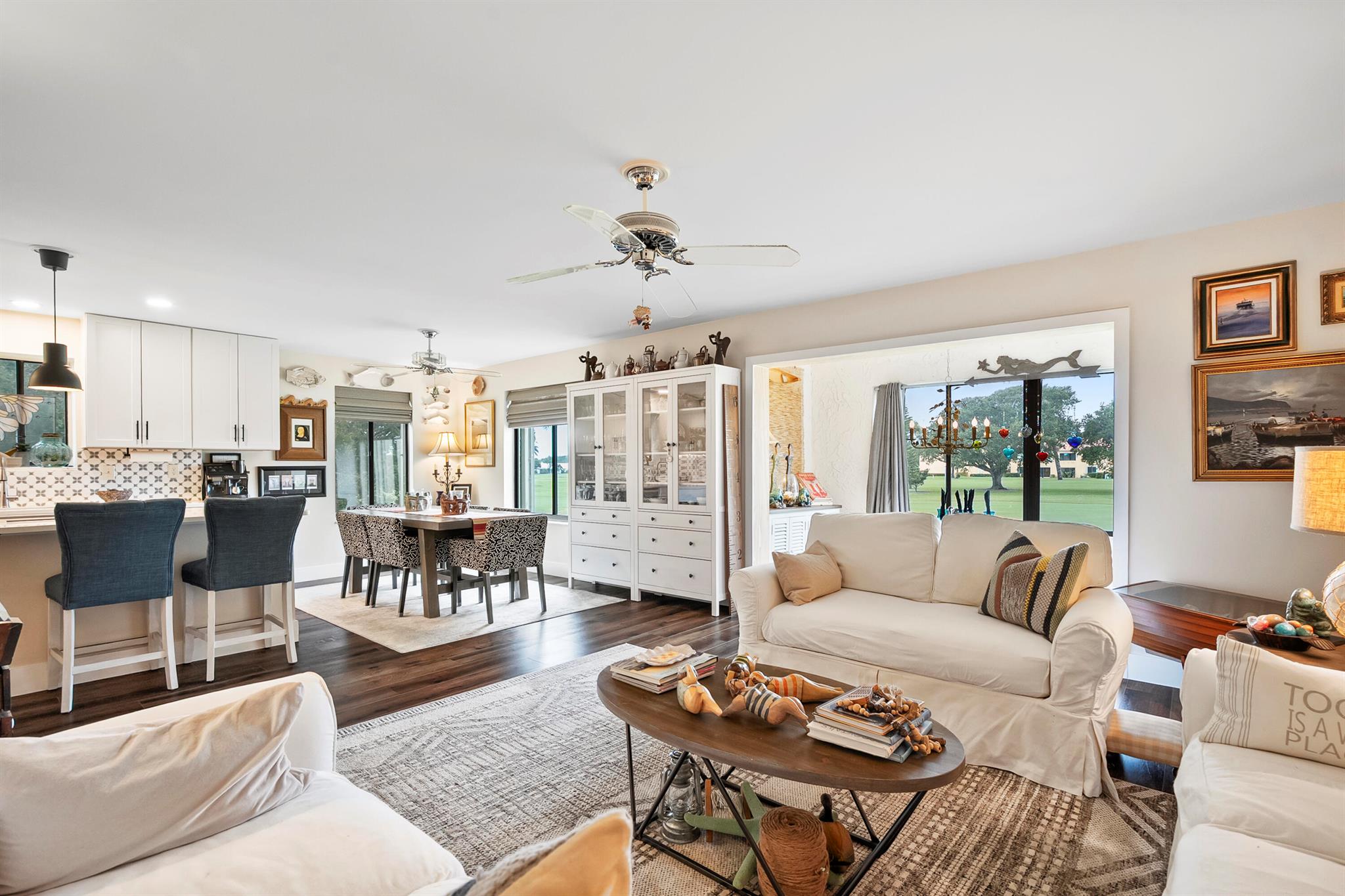 Sheer Elegance. Beautifully renovated 3-BEDROOM, END-UNIT condo in the desirable 55+ section of Miles Grant Country Club. Offering PRIVATE ENTRANCE, sophisticated interiors, and sweeping FAIRWAY VIEWS. The OPEN-CONCEPT floor plan is filled with natural light and refined designer finishes. Completely UPDATED in 2024, this condo features: All-new LUXURY FLOORING; modern OPEN KITCHEN; all NEW APPLIANCES; BEVERAGE FRIDGE; new A/C with UV light PURIFICATION; & SPA-INSPIRED renovations in both BATHROOMS. The 3rd bedroom is used as the media room and can easily convert into a luxurious guest suite. All windows are storm protected with accordion shutters. Roof was replaced in 2018 and includes attic storage. Furniture is negotiable, offering a turnkey opportunity for the right buyer.Community