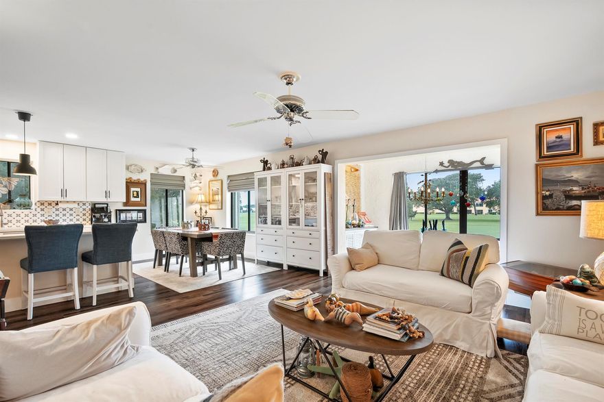 Sheer Elegance. Beautifully renovated 3-BEDROOM, END-UNIT condo in the desirable 55+ section of Miles Grant Country Club. Offering PRIVATE ENTRANCE, sophisticated interiors, and sweeping FAIRWAY VIEWS. The OPEN-CONCEPT floor plan is filled with natural light and refined designer finishes. Completely UPDATED in 2024, this condo features: All-new LUXURY FLOORING; modern OPEN KITCHEN; all NEW APPLIANCES; BEVERAGE FRIDGE; new A/C with UV light PURIFICATION; & SPA-INSPIRED renovations in both BATHROOMS. The 3rd bedroom is used as the media room and can easily convert into a luxurious guest suite. All windows are storm protected with accordion shutters. Roof was replaced in 2018 and includes attic storage. Furniture is negotiable, offering a turnkey opportunity for the right buyer.Community
