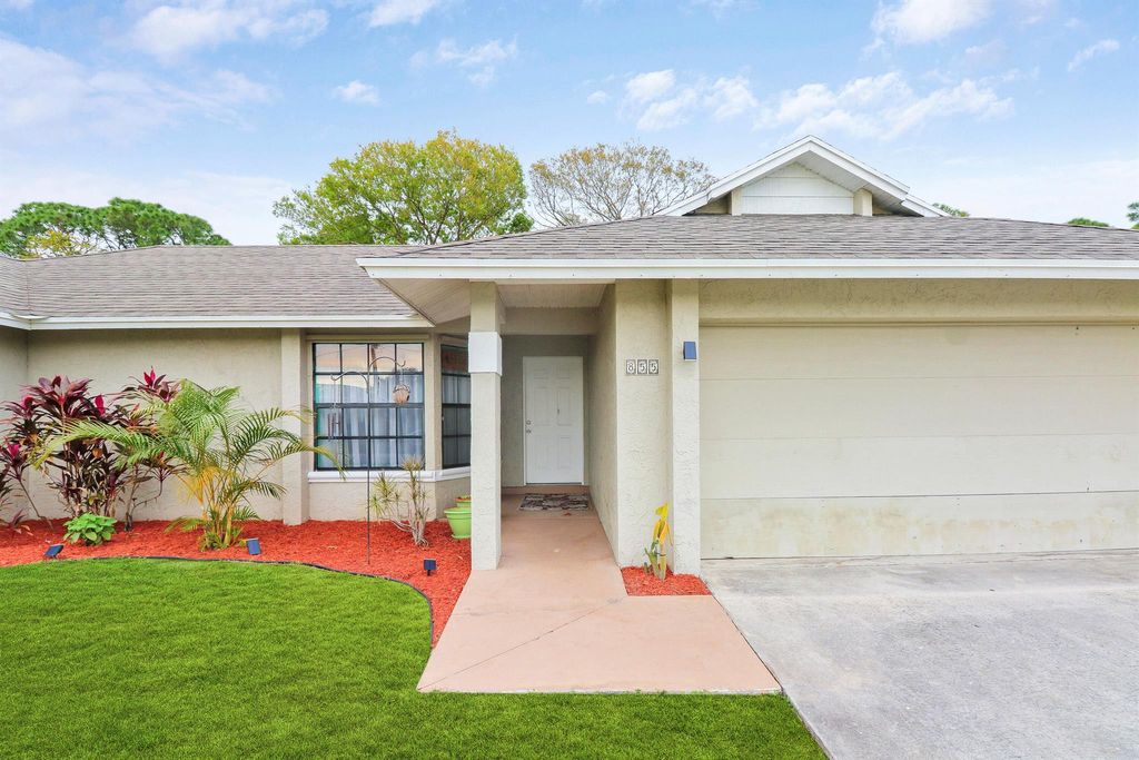 Photo of 855 SE Polynesian Avenue, Port Saint Lucie, FL 34983 (MLS # R10953609)