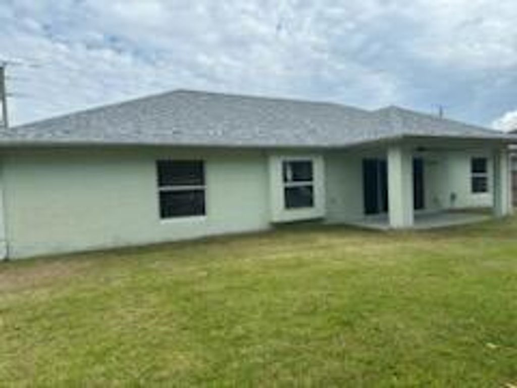 Photo of 512 SE Walters Terrace, Port Saint Lucie, FL 34953 (MLS # R11015302)