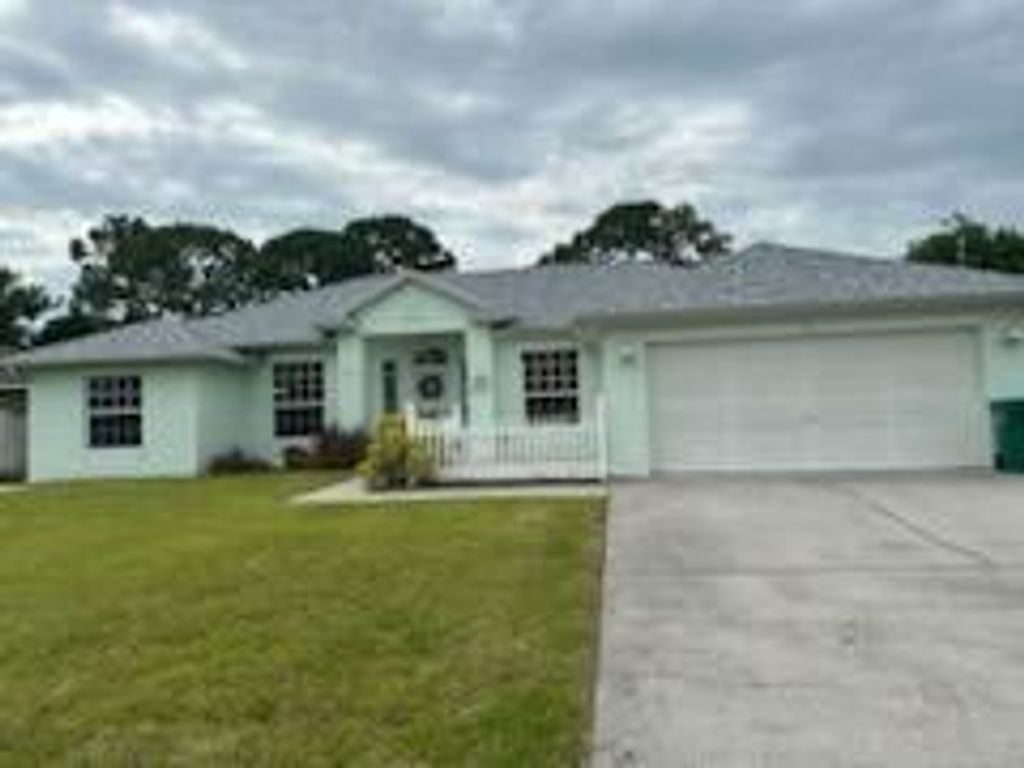 Photo of 512 SE Walters Terrace, Port Saint Lucie, FL 34953 (MLS # R11015302)