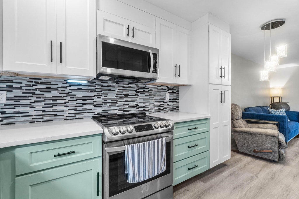 Photo of 2883 CROSLEY Drive W #F, West Palm Beach, FL 33415 (MLS # B26076901)