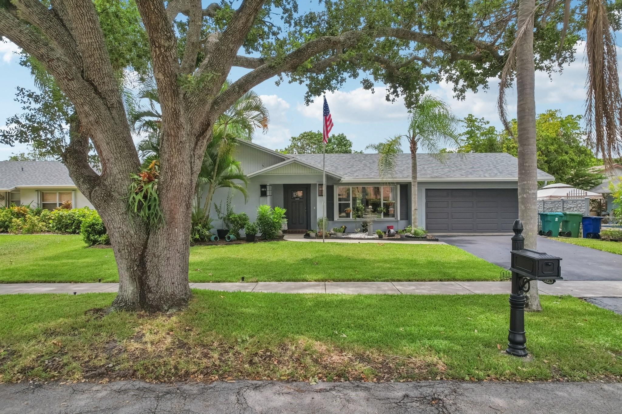 Beautifully updated 4-bedroom, 2-bath lakefront pool home in the highly desirable Flamingo Gardens community. Set in a family-friendly neighborhood and located within an A-rated school district, this home offers the ideal blend of comfort and peace of mind. Recent upgrades include a BRAND NEW roof with hurricane straps and water barriers, an impact-rated garage door, central AC, and three new custom impact sliding glass doors leading to the large patio. Inside, enjoy a renovated kitchen with new appliances, updated bathrooms, and modern flooring. Step outside to a spacious screened-in patio, private lakeside pool, and a new dock, perfect for relaxing or entertaining. A true gem in one of the area's most sought after neighborhoods.