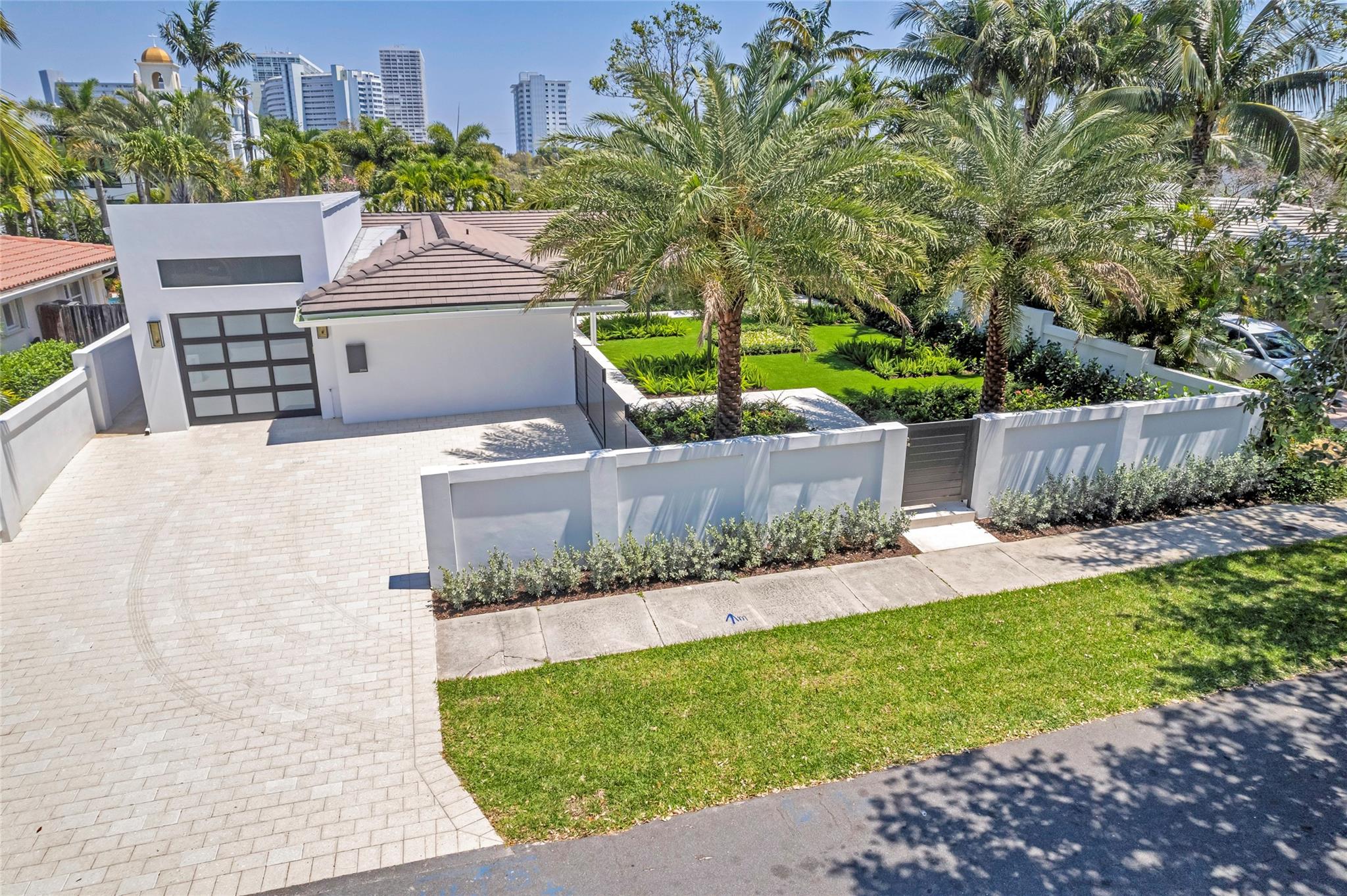 This newly remodeled & totally updated custom masterpiece in the coveted beachside Harbour Inlet neighborhood is a must see! This sophisticated barrier island residence will captivate you the moment you step past the walled gates & not to mention the pool/spa oasis that feels like a 5-Star resort setting. This luxury estate compound blends classic South Florida style & class with extensive & incredible nearly maintenance free grounds. No expense was spared in this complete gut renovation & crafted by respected custom builder Bresnahan Construction. A stunning abode that showcases all new natural stone flooring, custom gourmet kitchen w/ top-of-the-line appliances, quartz countertops, luxurious contemporary bathrooms, all new underground waste/supply pipes, electric, HVAC ducts/vents & more