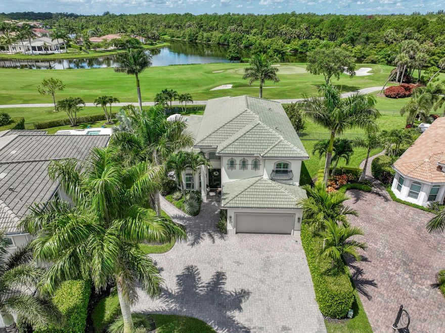 This exquisitely designed 2019-built home offers breathtaking lake, golf & preserve views from one of the best homesites in the resort style gated community of Jupiter Country Club. This rare Saviero model is one-of-a-kind and has 4 bedrooms, 4 baths plus a flex room/den. The prime cul-de-sac location within the community provides sweeping tree-lined views of Riverbend Park, the winding lake & the 11th green. Live comfortably in this energy efficient home with CBS construction, natural gas, reverse osmosis water filtration system in kitchen, and impact glass windows & doors throughout. The newly replaced custom impact glass front door and voluminous two story ceilings welcome you into the open concept great room with immediate backyard views through the wall to wall windows.
