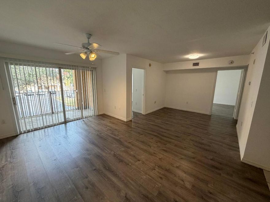 Great 2/1 condo. The main liiving area and the bedroom has vinyl flooring. The master bedroom includes a walk-in closet, and the unit comes with a full-size washer and dryer. The kitchen opens to the living room, enhancing the space's open feel. This condo is located in a gated community with amenities like a resort-style clubhouse, pool, hot tub, gym, racquetball, basketball, tennis, volleyball courts, and a playground. The HOA covers basic cable, internet, water, and sewer. Centrally located