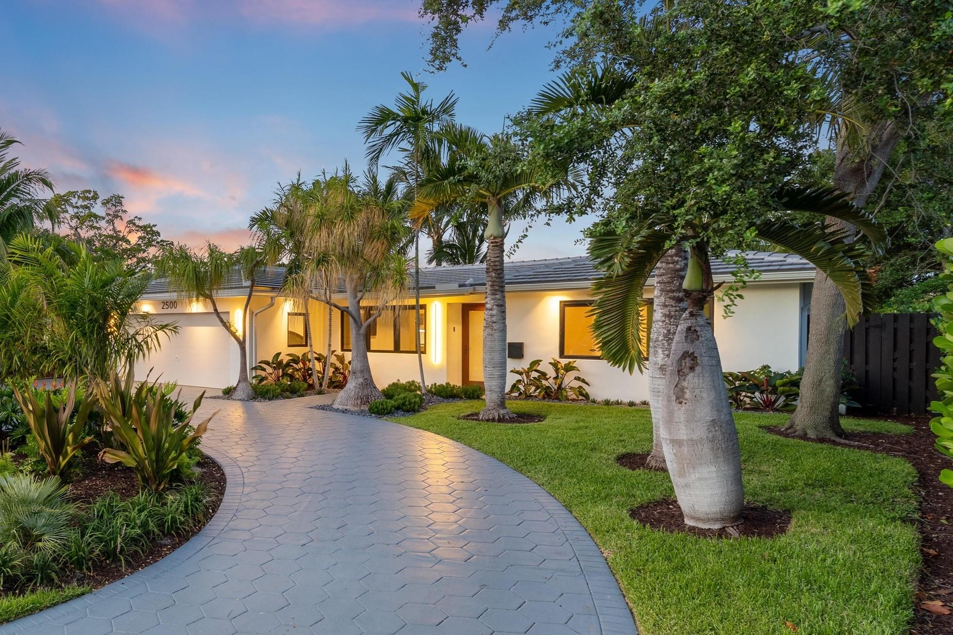 This refined waterfront home has all the design elements luxury buyers expect including a grey flat tile roof (2023); an open floor plan with triple split bedrooms and dramatic vaulted ceilings; a chef’s kitchen with oversized island, bar area with wine storage, custom cabinetry, and high-end appliances; relaxing water views with ocean access for boaters; spa-like bathrooms with fabulous fits and finishes; a 2-car garage with circular drive; impact windows and doors (2021); and professionally-landscaped yards with room for your dream pool. You need to see it in person to appreciate the thoughtful design and attention to detail. Located in the sought-after Coral Point neighborhood in east Wilton Manors, all of the dining and nightlife offerings along Wilton Drive are 10 short blocks away!